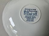 a white bowl with a blue and white label on it