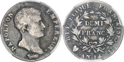 a close up of a silver coin with a picture of a man on it