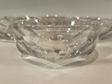 three clear glass bowls sitting on a white table