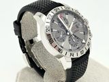a watch that is sitting on a stand on a white surface