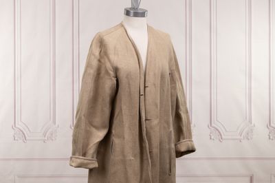an image of a beige coat on a mannequin mannequin mannequin mannequin mannequin mannequin mannequin mannequin