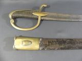 two different types of knives on display on a table