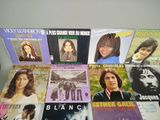 a lot of various vinyl records on the table