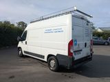 a white van that is parked in a parking lot