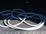 a bunch of wires in the trunk of a car