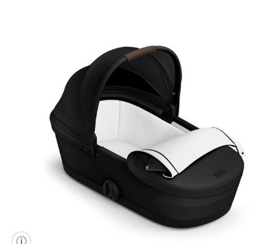 a close up of a stroller with a baby in it on a white background