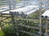 a lot of pipes that are sitting in the grass