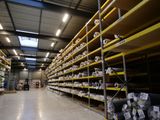 a large warehouse filled with lots of shelves filled with items