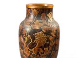 an image of a vase with a lion on it