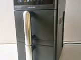 an image of a coffee machine with a digital clock on it