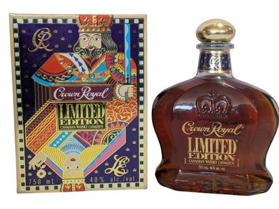 a close up of a bottle of liquor next to a box