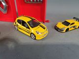 three toy cars sitting next to each other on a table