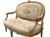 an image of a chair with a floral upholstered back and arms