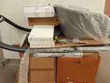 a pile of boxes on a pallet in a warehouse