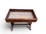 an old wooden table with a glass top on a white background