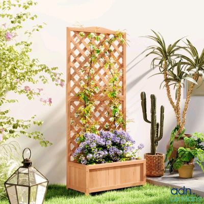 a wooden planter with plants in it on the grass