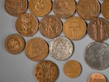 a lot of coins that are laying on a table