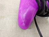 a purple blow dryer with a black cord attached to it
