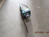 a small machine that is on the floor in a room