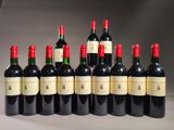 six bottles of wine are lined up in a row on a table