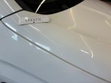 a sticker on the hood of a white car
