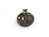 an image of a close up of a watch movement on a white surface