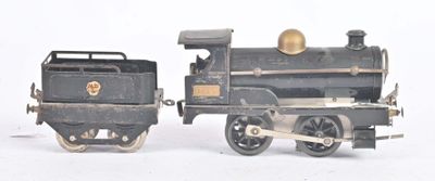 a toy train that is sitting next to another toy train