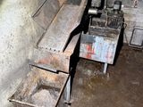 a dirty kitchen with a sink and a stove in it