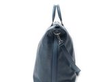 blue leather handbag on white background with clipping for text