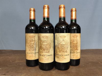 three bottles of wine sitting on top of a wooden table