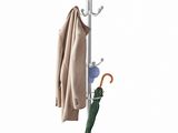 a coat rack with an umbrella and a coat hanger on it