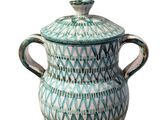 an image of a blue and white vase with a lid