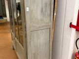 a tall cabinet with a fire extinguisor next to it