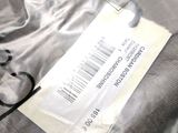 an image of a close up of a t - shirt with a price tag on it