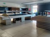 many stacks of books on the floor in the store