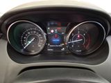 a close up of a car dashboard with various gauges