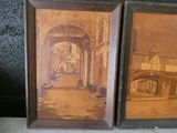two framed pictures of old buildings on the wall
