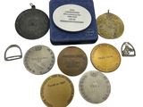an image of a collection of medals including a medal, a medal, a medal, a medal, and a medal