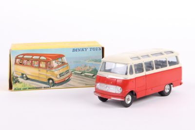 a toy bus that is sitting next to a box