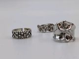 two silver rings and a silver ring on a white surface