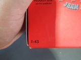 a person holding a red box with a picture on it