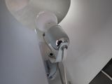 a hair dryer that is on the wall in the bathroom