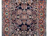 tapis persan antique à motif floral sur fond noir