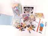 a lot of toys and books on the table
