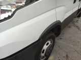 a white van that is parked on the side of the street