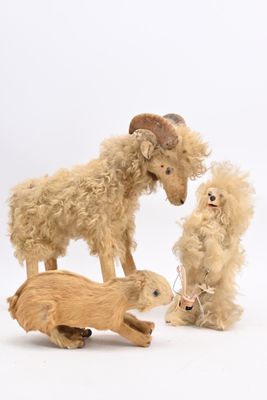 three stuffed animals that are standing next to each other
