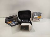 a camera that is sitting on a table next to a box