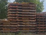 a lot of crates stacked on top of each other in the grass