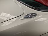 a close up of a car ' s emblem on the side of the car