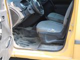 a yellow van with the door open and the driver ' s seat down